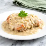smothered chicken with creamy onion gravy - featured image
