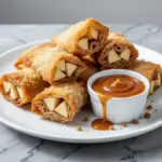 crispy apple cinnamon egg roll bites - featured image